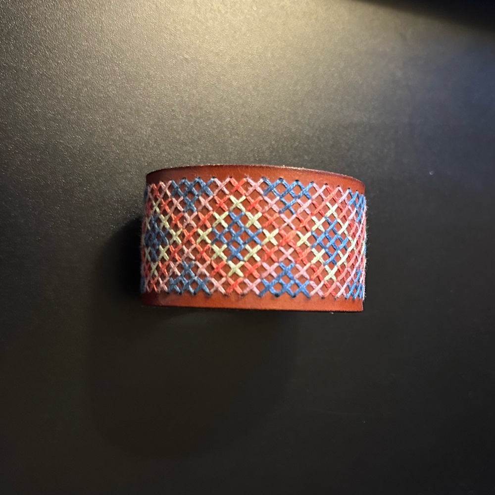Leather cuff with cross stitch pattern. Hand stitched by me!